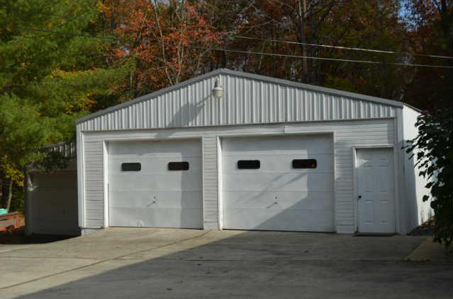 446 Belmont Road Manchester, TN 37355 - Photo 18 of 20 The 3-Car Detached Garage is HUGE! Offering: built in shelving/cabinetry, electricity, 220 wiring, phone & water lines, and office area, and an old caboose stove!
