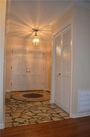 446 Belmont Road Manchester, TN 37355 - Photo 5 of 20 This beautiful Foyer leads to the Formal Living Room, Formal Dining Room, and the Den. It offers an oversized coat closet, nice lighting fixture, & great stone floor.