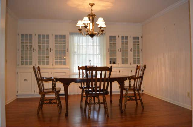 446 Belmont Road Manchester, TN 37355 - Photo 6 of 20 The beautiful Dining Room offers built-in shelving for all of your china, crystal, collectibles, & more! Also note the beautiful hardwood flooring, chandelier, & picture window.