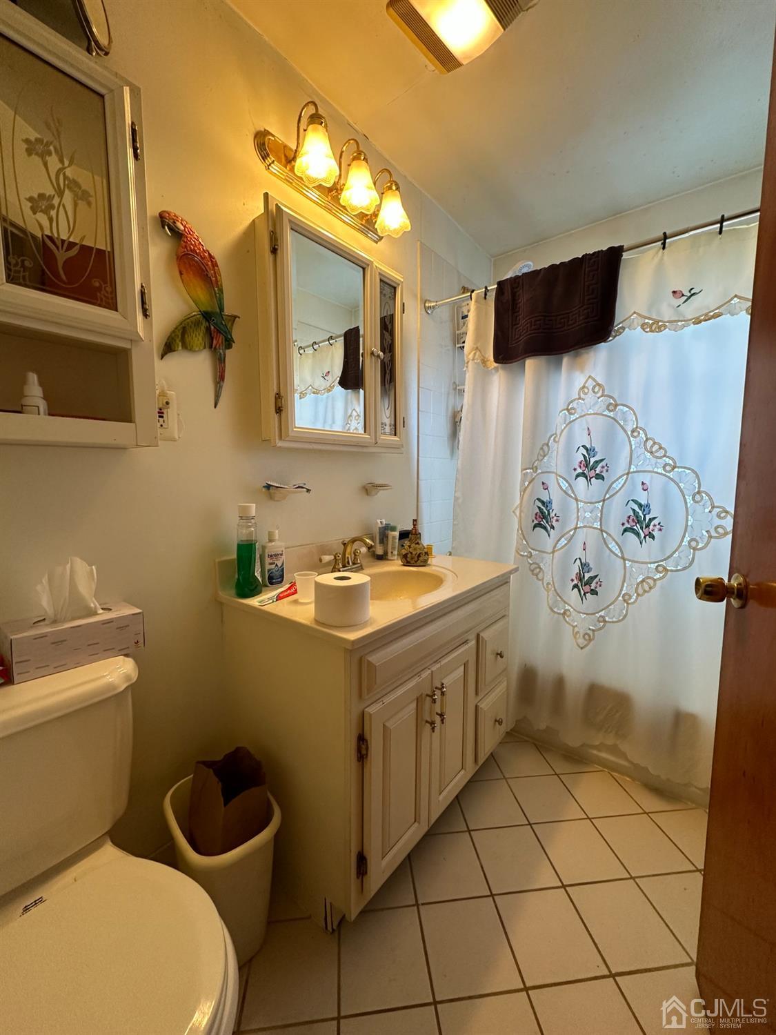 9 Ashley Road Edison, NJ 08817 - Photo 8 of 14 a bathroom with a sink toilet and shower