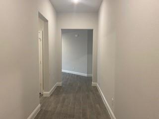 930 Waterview Drive Prosper, TX 75078 - Photo 2 of 17 a view of a hallway with wooden floor