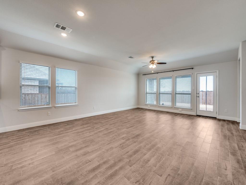 930 Waterview Drive Prosper, TX 75078 - Photo 10 of 17 wooden floor in an empty room with a window