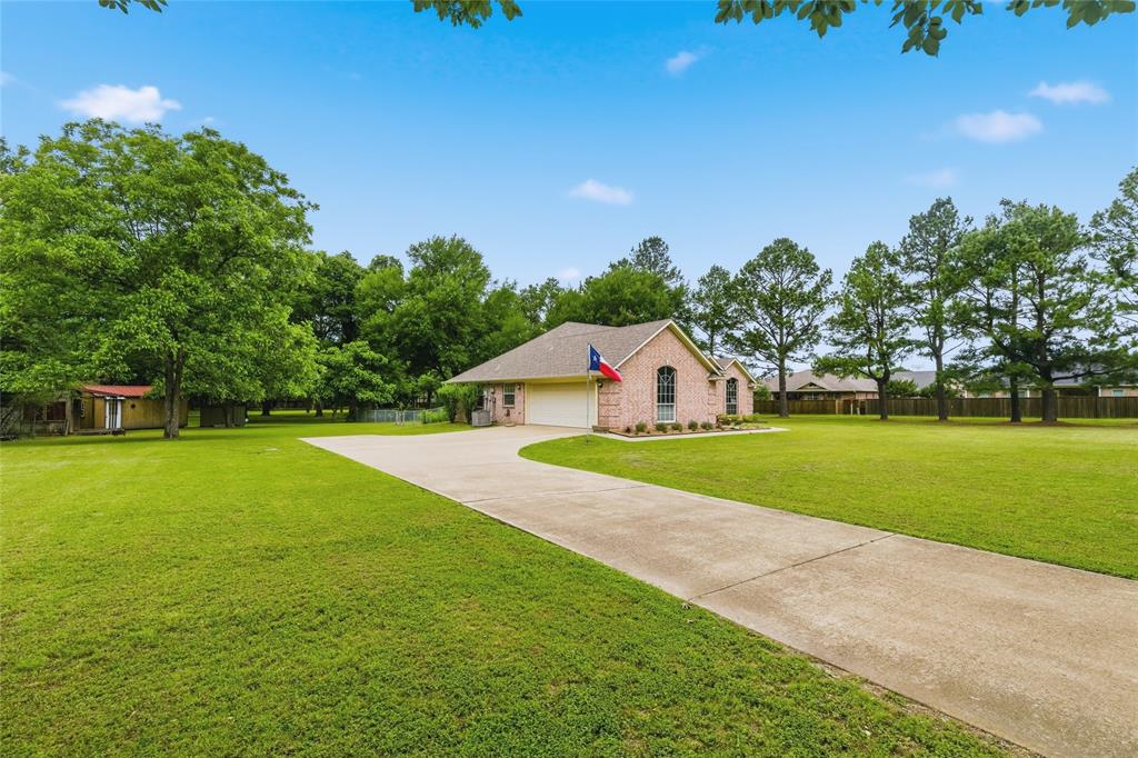 2917 Harlow Road Commerce, TX 75428 - Photo 2 of 40 a view of a house with a yard