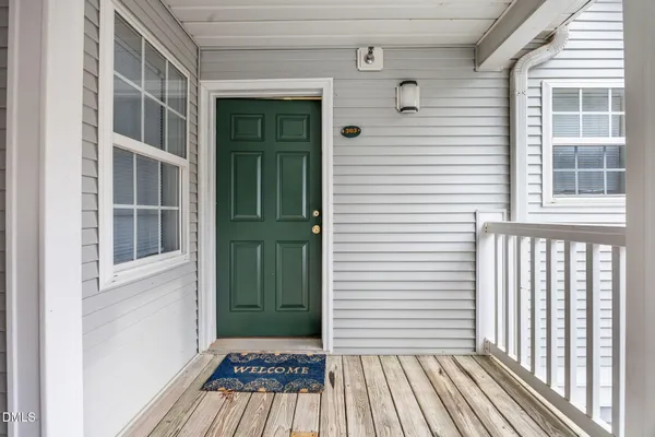 a view of a house with a door and a window