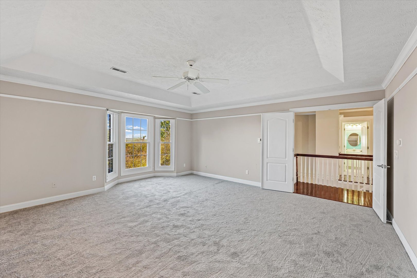 1 Windsong Way Bloomington, IL 61704 - Photo 32 of 90 a view of an empty room with a window
