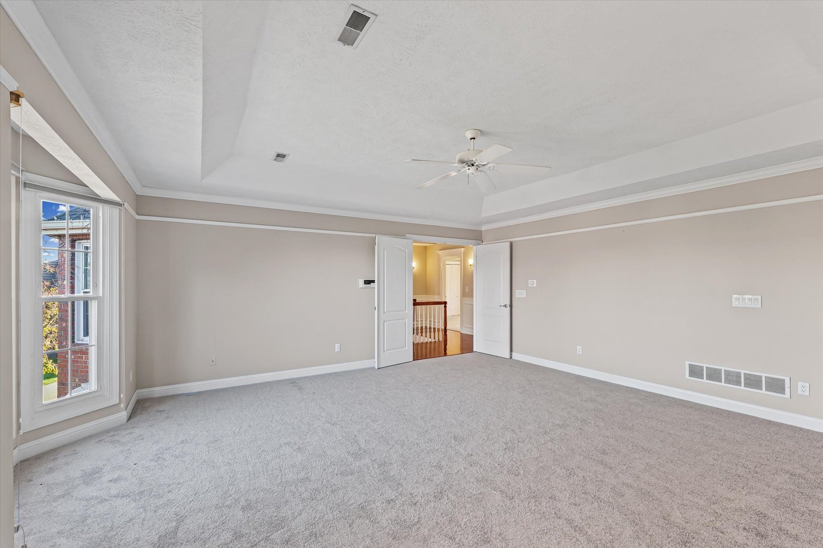 1 Windsong Way Bloomington, IL 61704 - Photo 34 of 90 a view of an empty room with a window