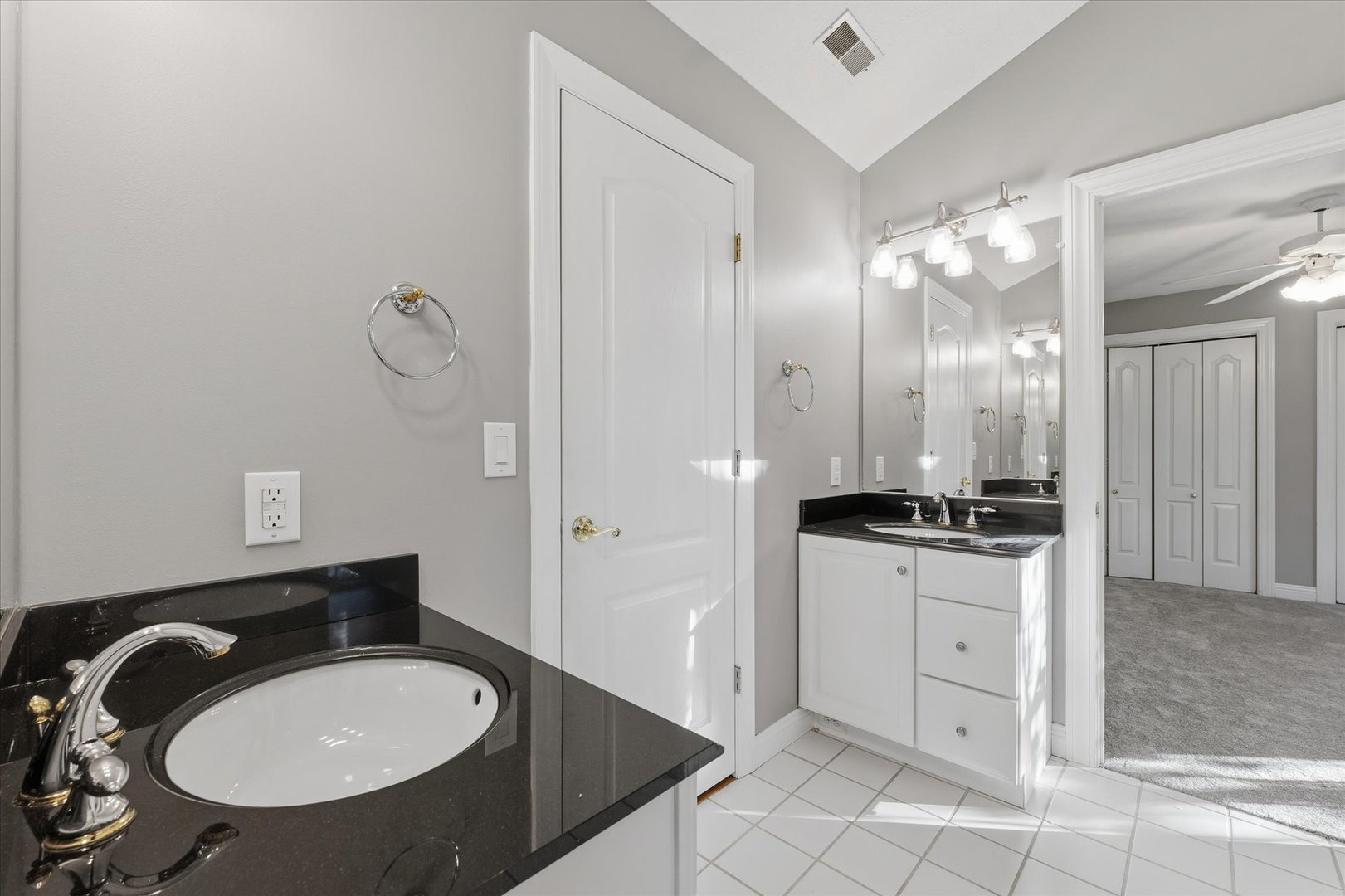 1 Windsong Way Bloomington, IL 61704 - Photo 45 of 90 a bathroom with a sink double vanity and a mirror