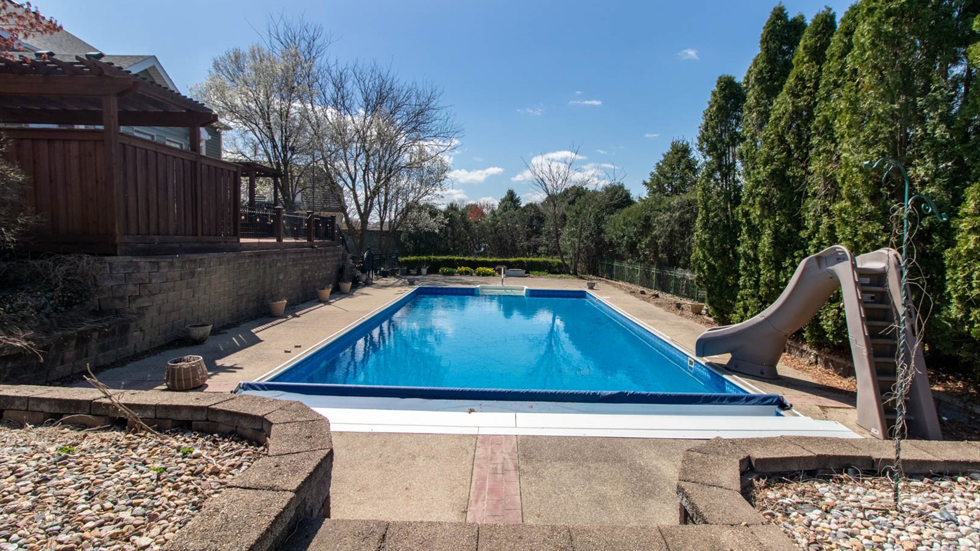 1 Windsong Way Bloomington, IL 61704 - Photo 75 of 90 a wooden bench sitting in front of a house