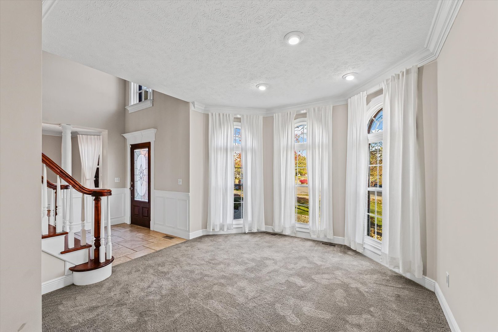 1 Windsong Way Bloomington, IL 61704 - Photo 9 of 90 a view of an empty room with stairs