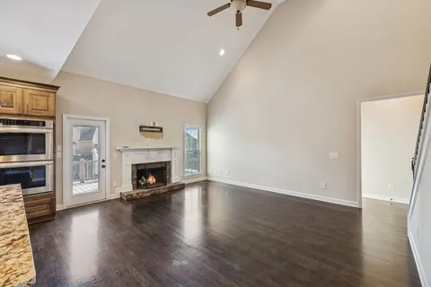 a view of kitchen with cabinets and wooden floor