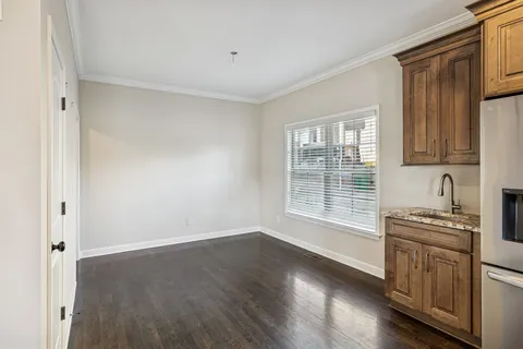 a kitchen with stainless steel appliances granite countertop a stove and cabinets