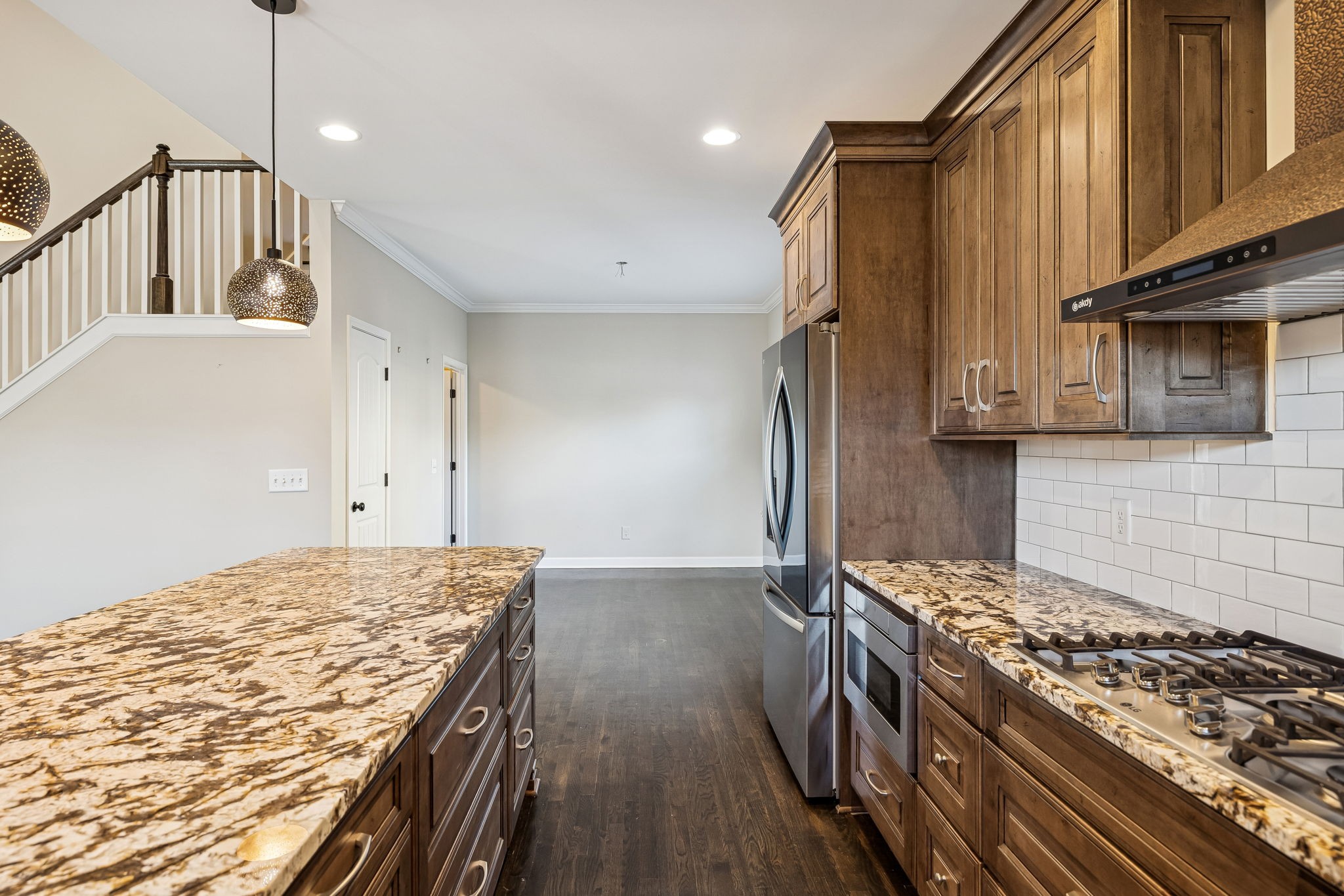 2002 Searles Court Spring Hill, TN 37174 - Photo 22 of 49 a kitchen with stainless steel appliances granite countertop a stove and a wooden cabinets