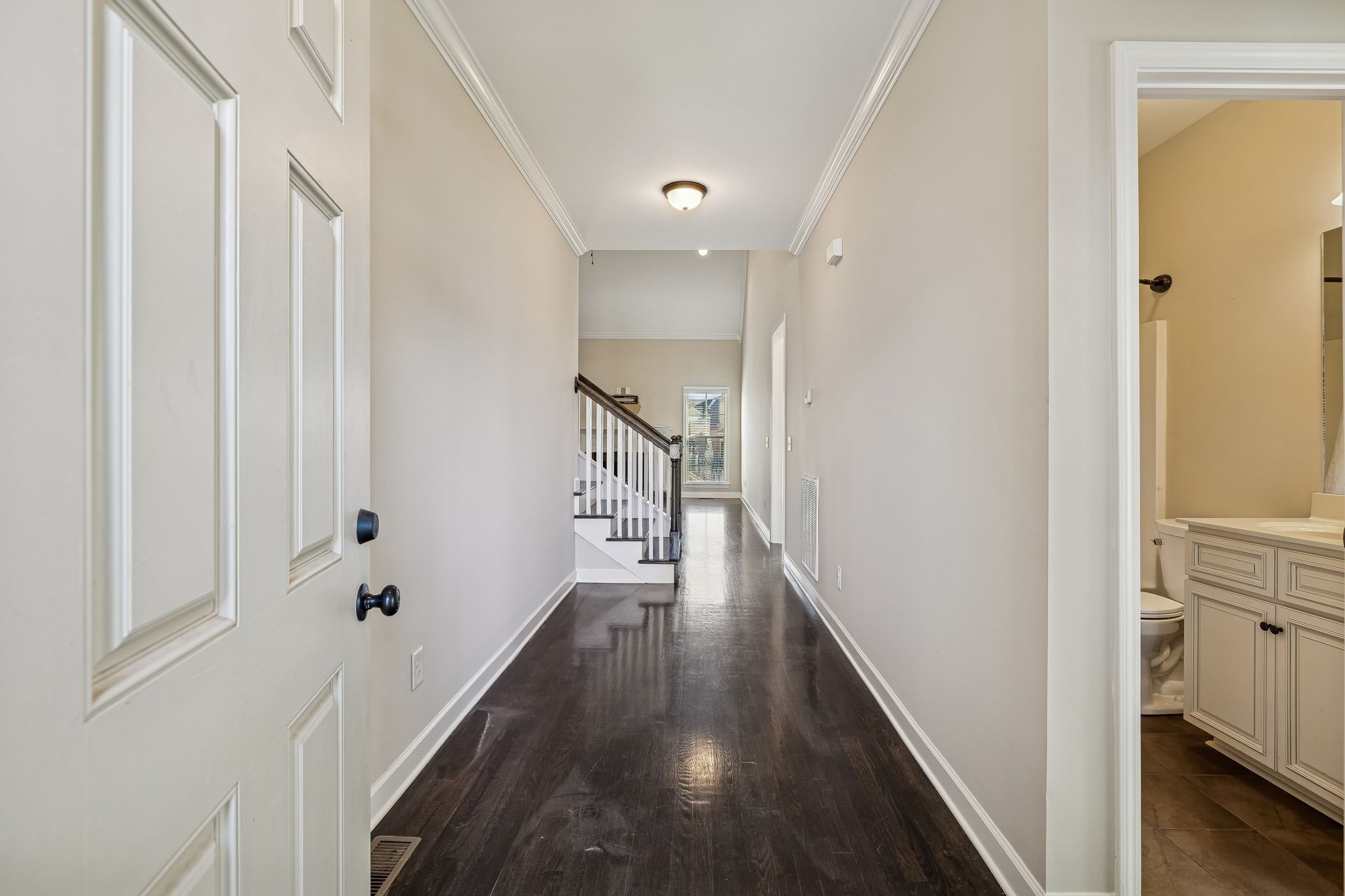 2002 Searles Court Spring Hill, TN 37174 - Photo 24 of 49 a view of a hallway with wooden floor and staircase