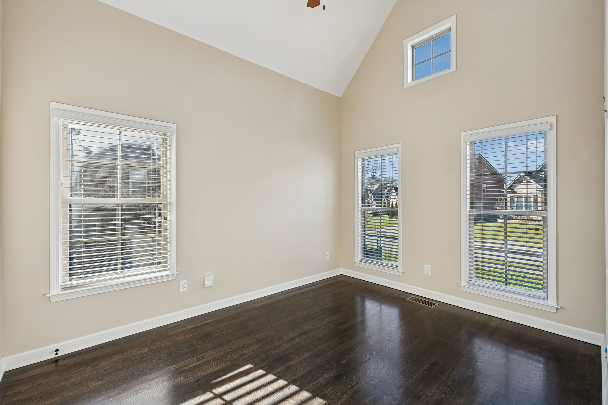 2002 Searles Court Spring Hill, TN 37174 - Photo 26 of 49 a view of an empty room with wooden floor and windows