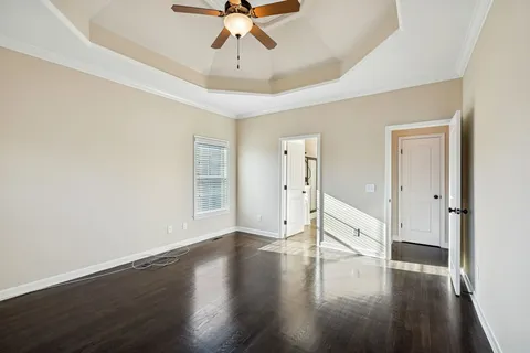a white bath tub sitting next to a shower