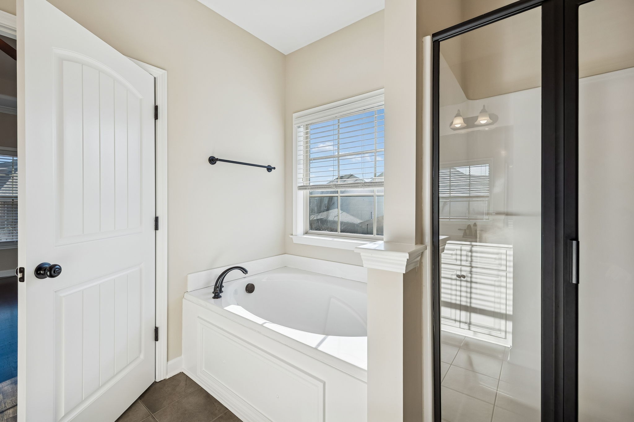 2002 Searles Court Spring Hill, TN 37174 - Photo 33 of 49 a white bath tub sitting next to a shower
