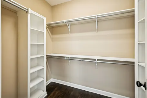 a bathroom with a sink a toilet a mirror and shower