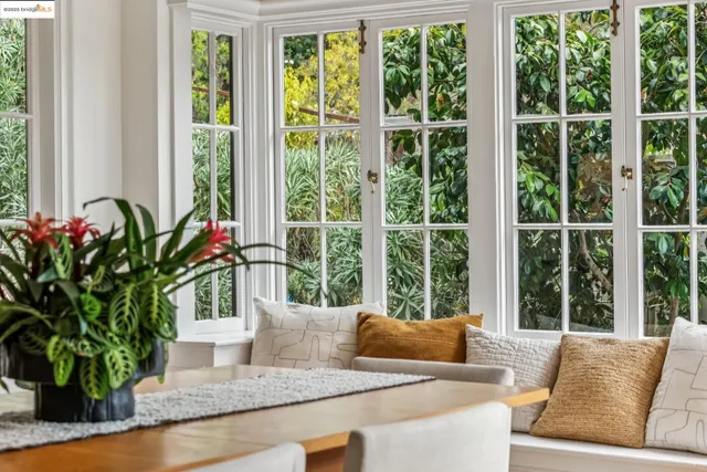 a view of a dining room with furniture and window