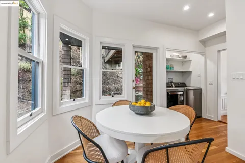 a kitchen with a stove top oven and refrigerator