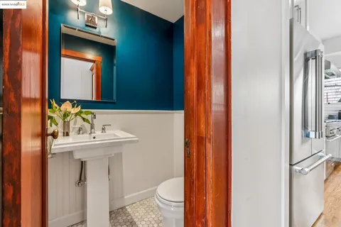 a spacious bedroom with a bed and lamp