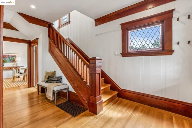 a bedroom with furniture and large windows