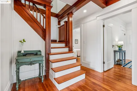 a bathroom with a granite countertop sink mirror and a bathtub