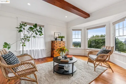 a bedroom with furniture and wooden floor