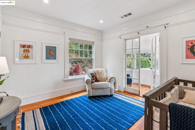 a living room with furniture potted plant and a window