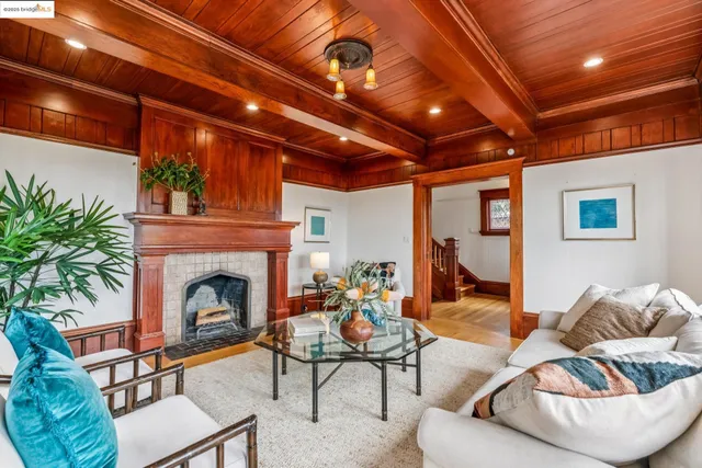 a dining room with furniture a rug and wooden floor