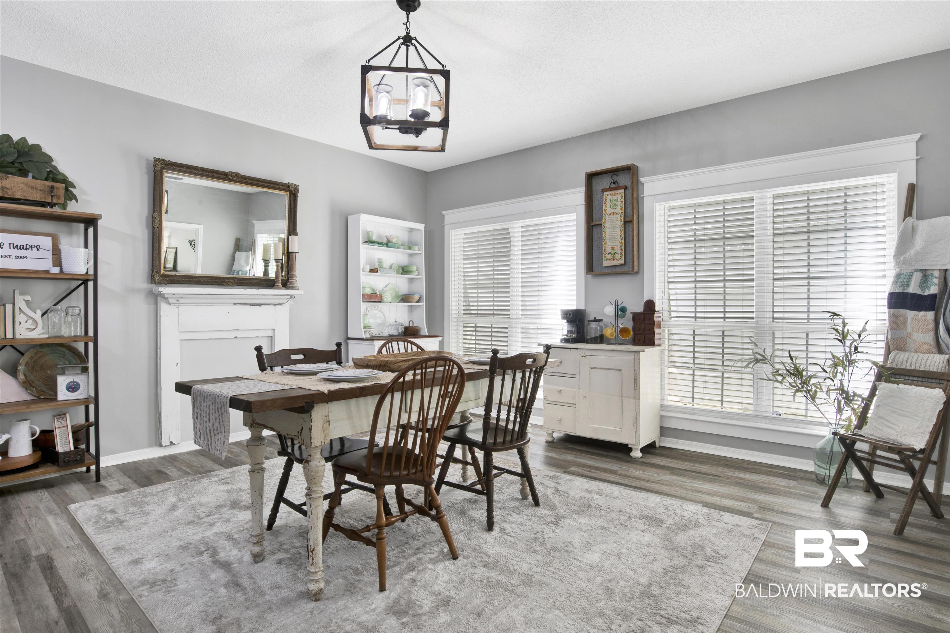 25700 Austin Road Daphne, AL 36526 - Photo 8 of 36 Dining area featuring wood finished floors and a chandelier