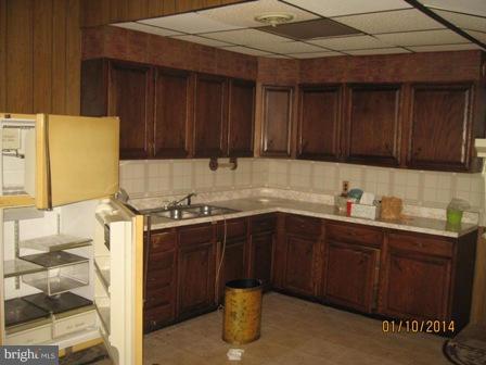 1518 Leslie Road Baltimore, MD 21222 - Photo 4 of 13 a kitchen with a sink and cabinets