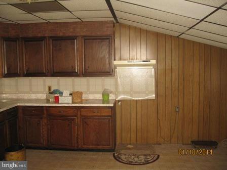 1518 Leslie Road Baltimore, MD 21222 - Photo 5 of 13 a kitchen with a sink and cabinets