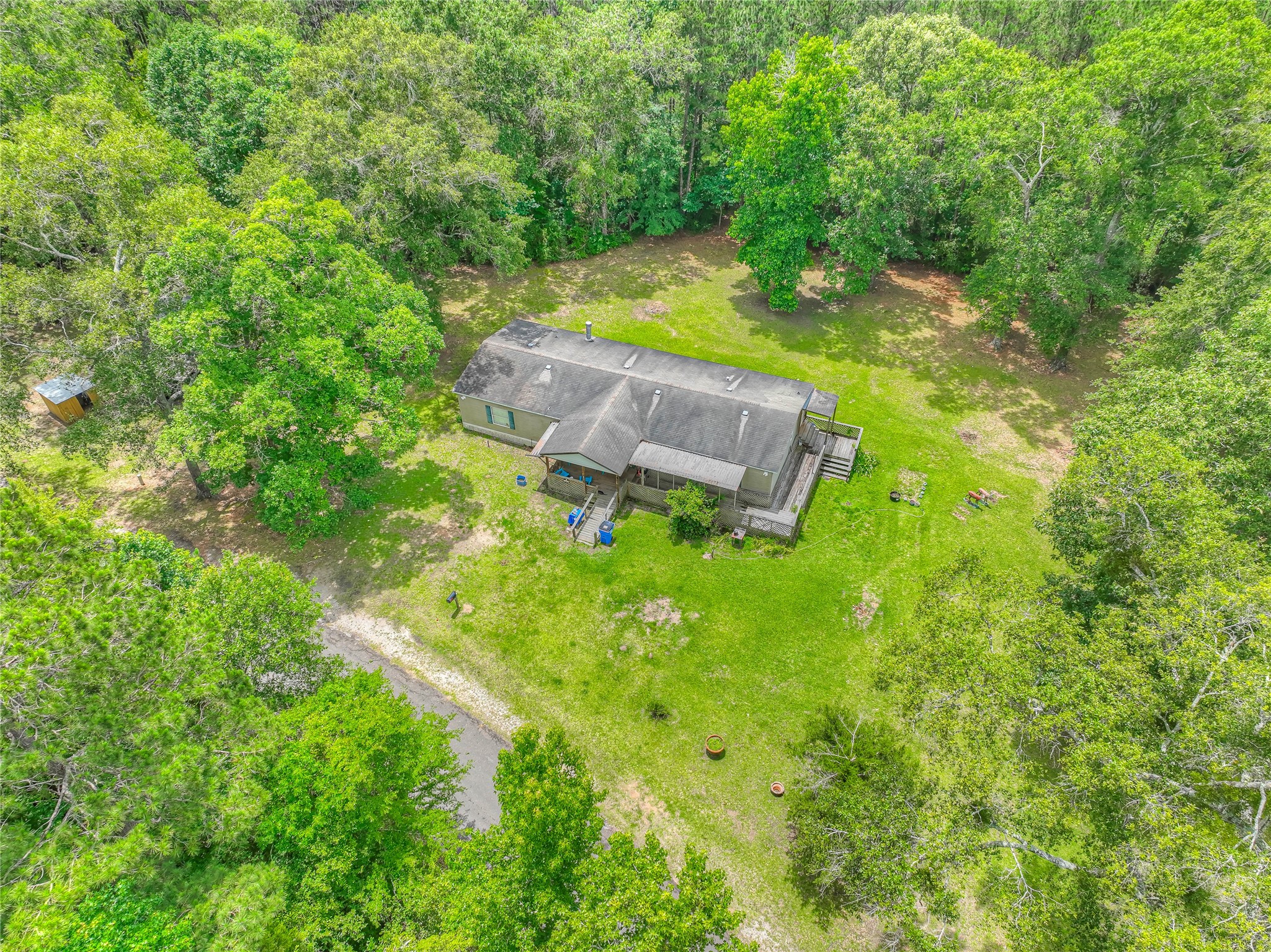 657 Parrish Road Livingston, TX 77351 - Photo 47 of 47 a backyard of a house with lots of green space