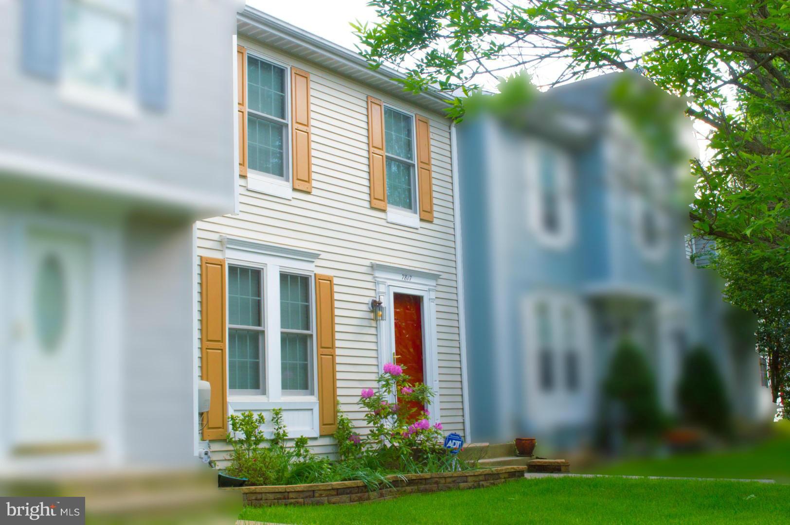 7817 Paddock Way Baltimore, MD 21244 - Photo 2 of 22 a front view of a house with garden