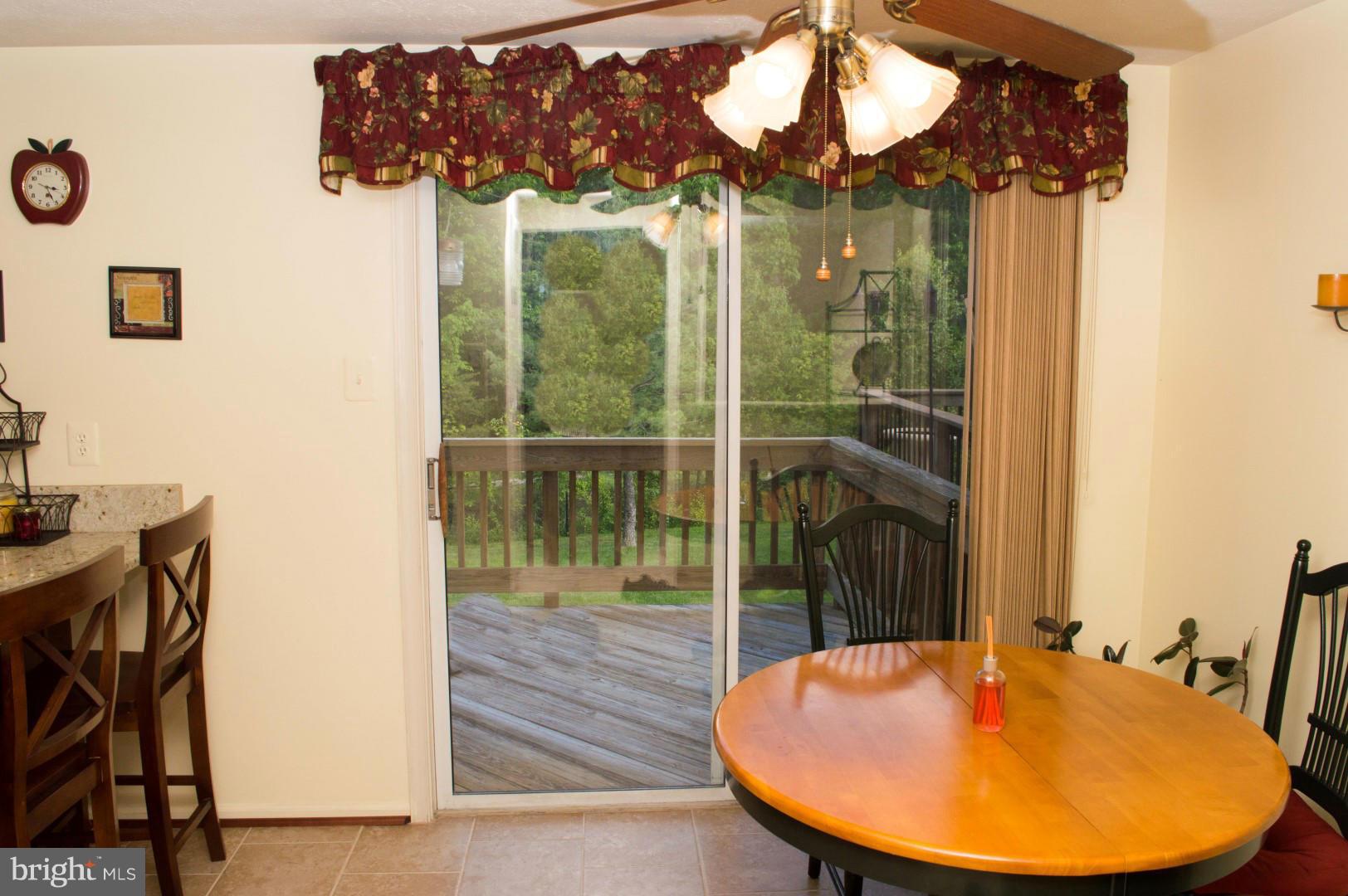 7817 Paddock Way Baltimore, MD 21244 - Photo 11 of 22 a view of a dining room with furniture window and outside view