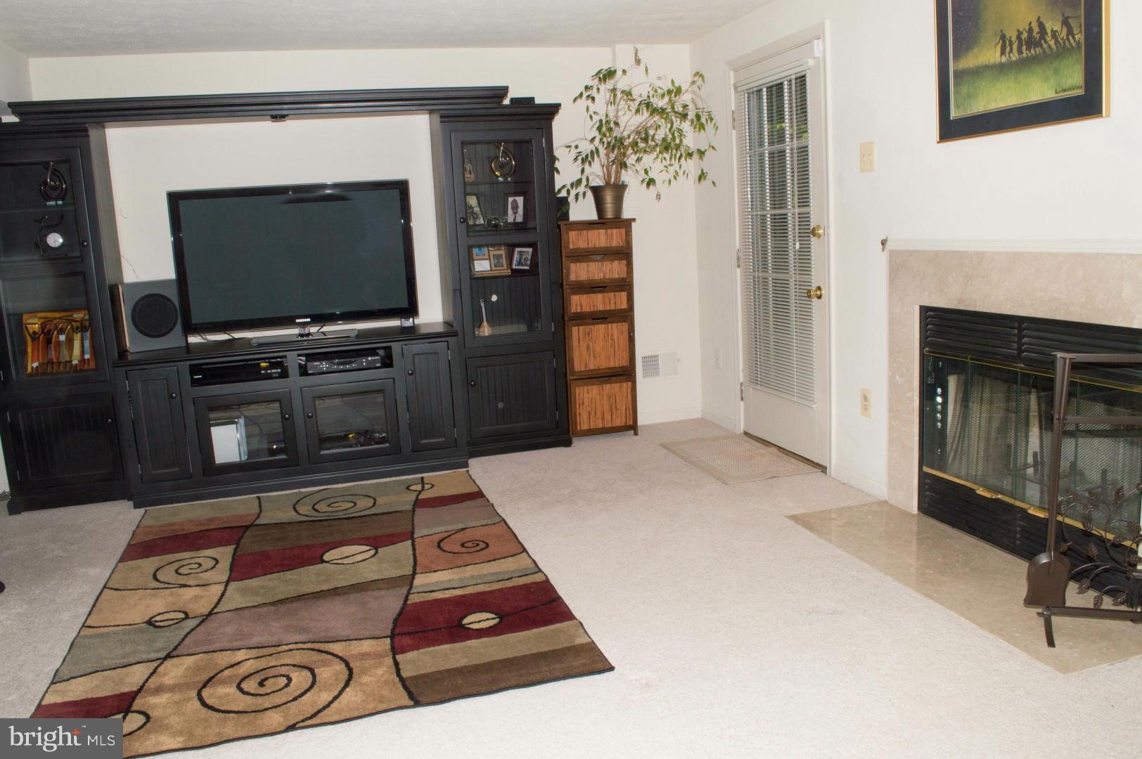 7817 Paddock Way Baltimore, MD 21244 - Photo 16 of 22 a living room with furniture and a flat screen tv