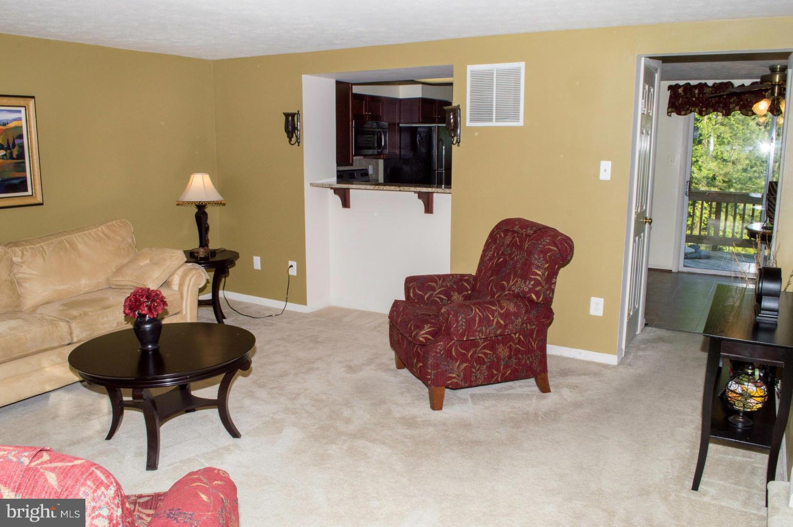 7817 Paddock Way Baltimore, MD 21244 - Photo 3 of 22 a living room with furniture and a chandelier