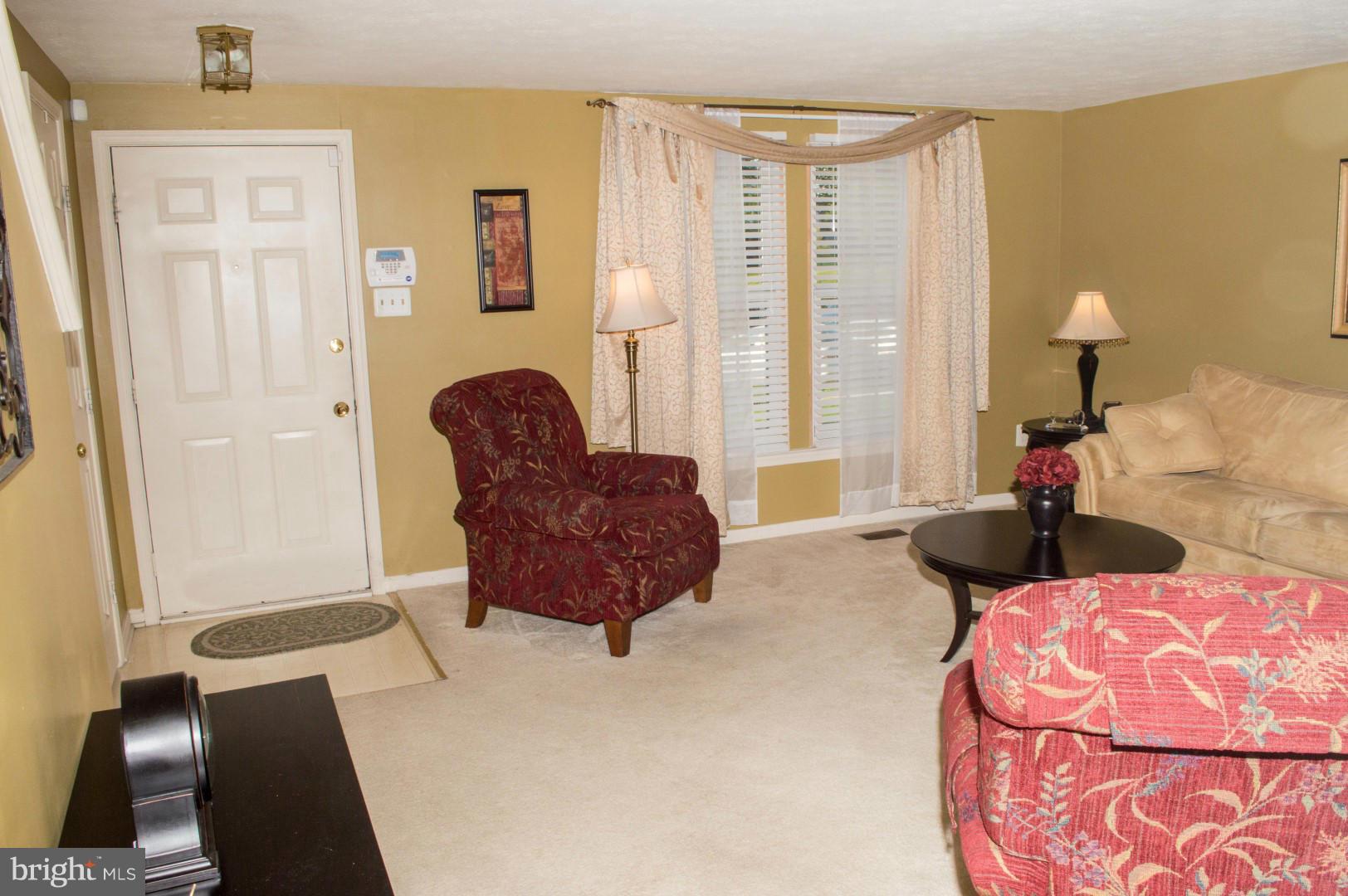 7817 Paddock Way Baltimore, MD 21244 - Photo 6 of 22 a living room with furniture and a large window