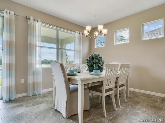 a view of a house with a yard and sitting space