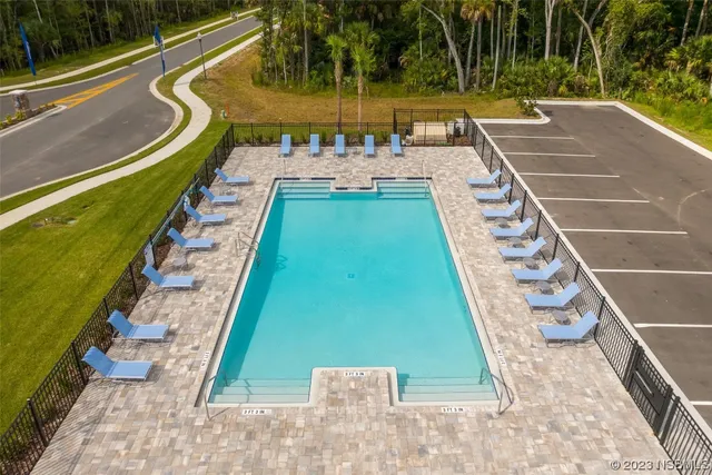 a view of a swimming pool with a patio