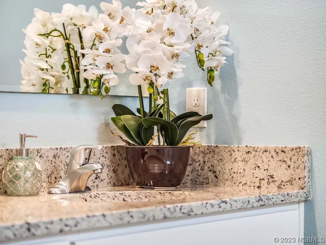 a vase of flowers sitting on a table