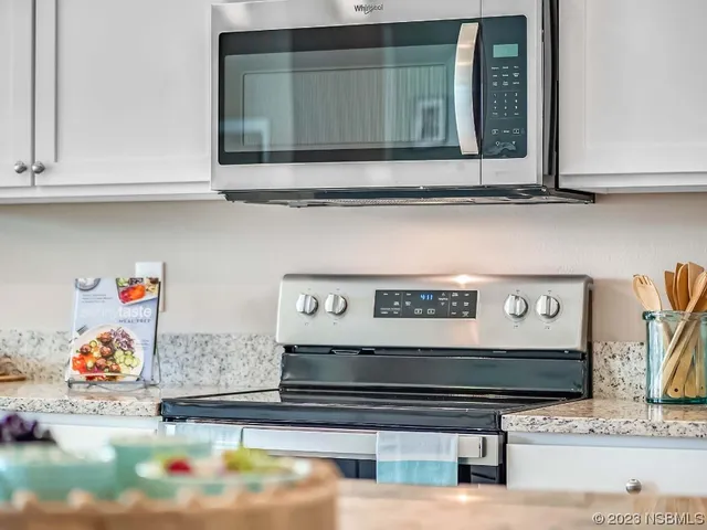a room with a potted plant on a table and a potted plant