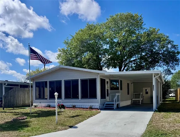 a front view of a house with garden and porch