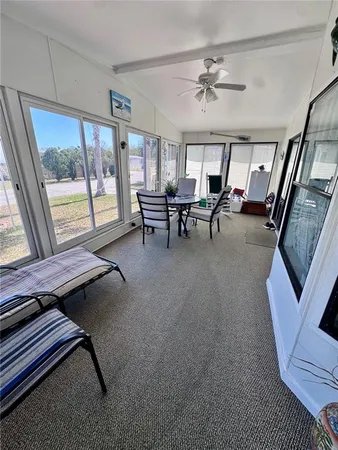 a view of a livingroom with furniture and window