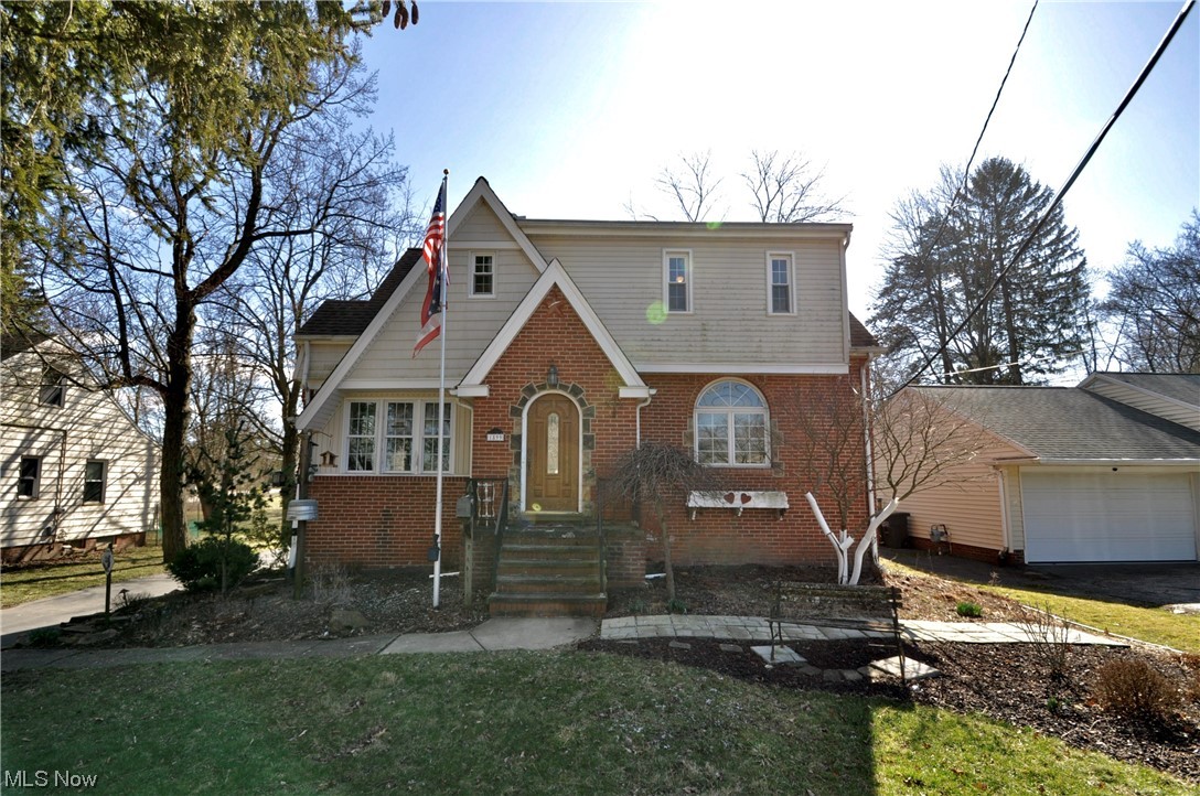 1899 West Pleasant Valley Road Parma, OH 44134 - Photo 2 of 47 Tudor house with a front lawn and a garage