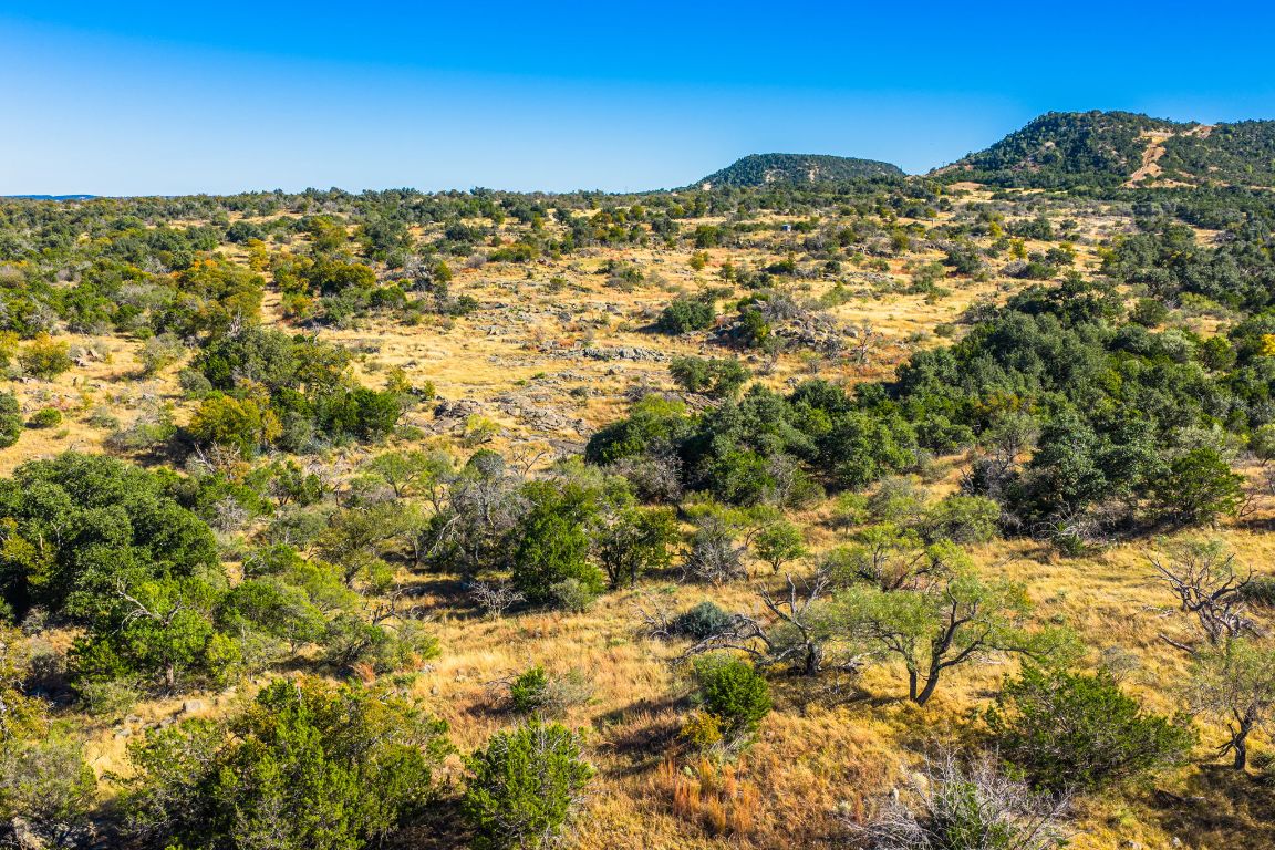 527 Walter Road Fredericksburg, TX 78624 - Photo 12 of 39 a view of a large body of water with a building in the background