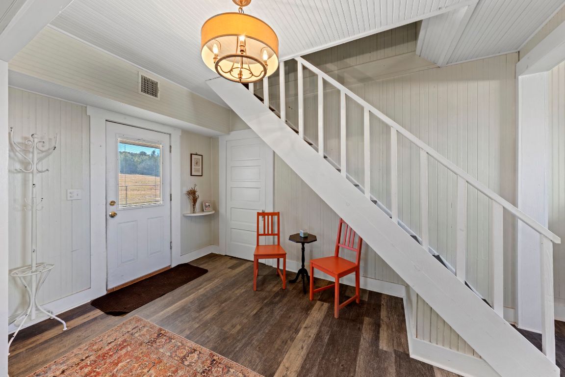 527 Walter Road Fredericksburg, TX 78624 - Photo 14 of 39 a view of entryway and hall with wooden floor