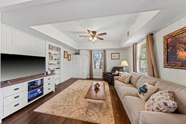 a kitchen with stainless steel appliances kitchen island granite countertop a refrigerator and a stove top oven