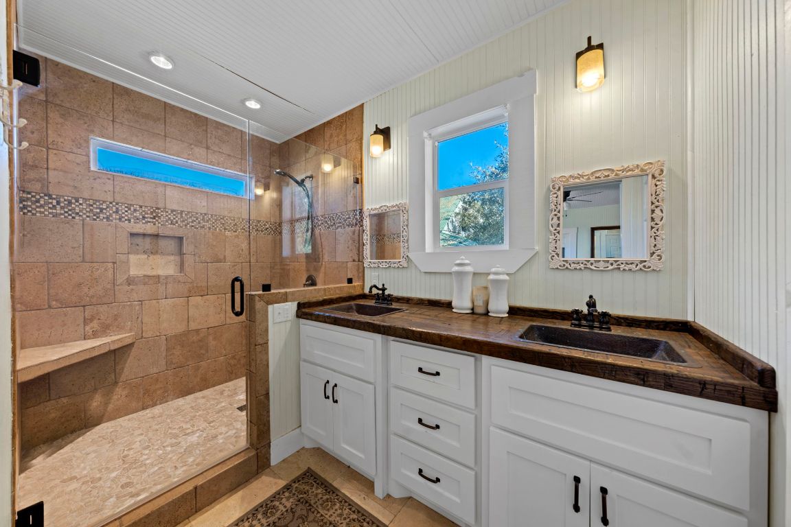 527 Walter Road Fredericksburg, TX 78624 - Photo 18 of 39 a bathroom with a sink and a mirror