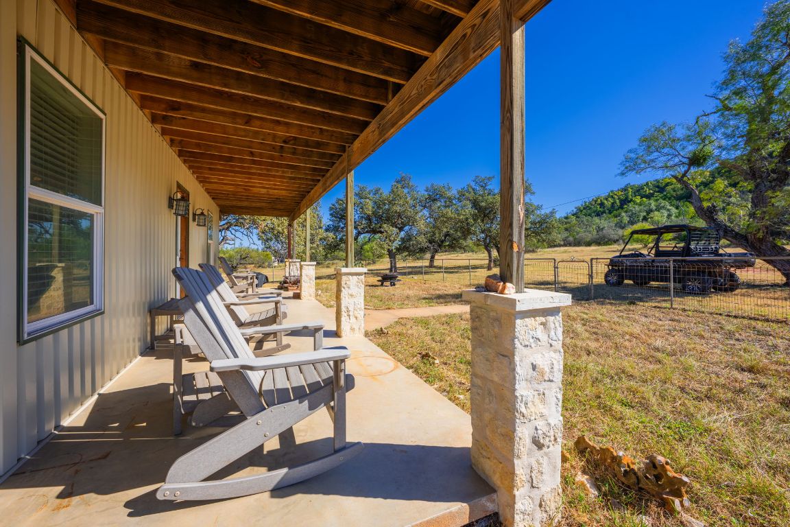 527 Walter Road Fredericksburg, TX 78624 - Photo 23 of 39 a view of balcony with wooden floor and outdoor seating